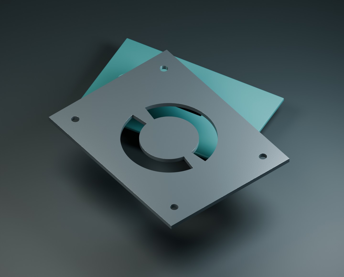 A metal plate with two stencil bridges keeping its circular centre attached, above a second cut part